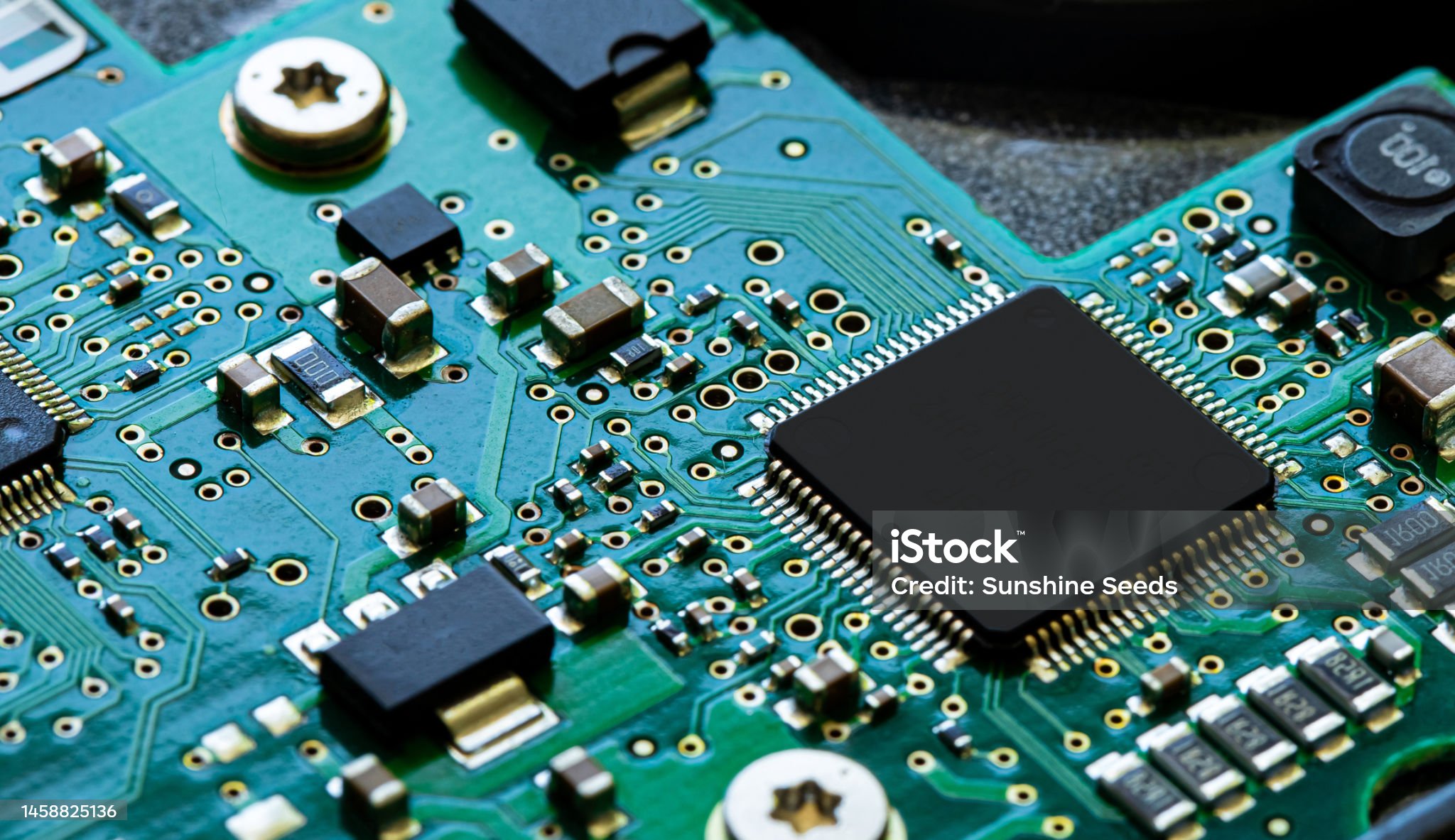 Macro Close up of components and microchips on PC circuit board of Hard Disc Drive